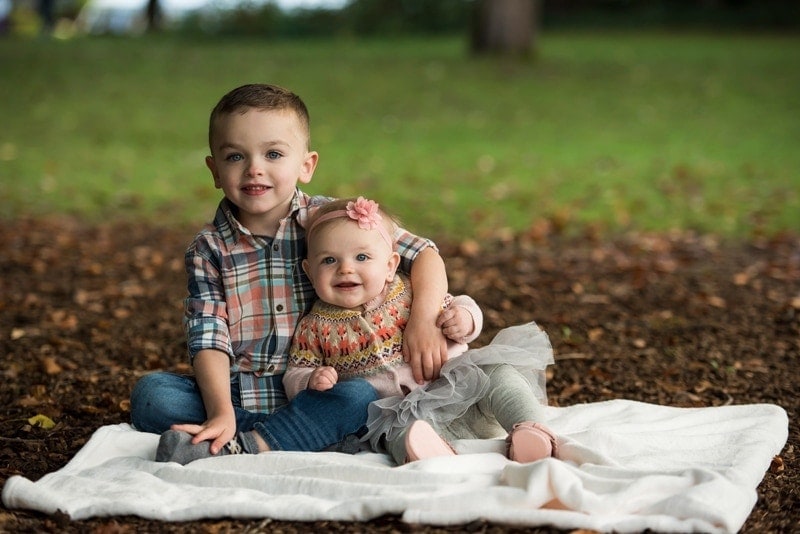 Family Photography, little brother and baby sister sitting on blanket together