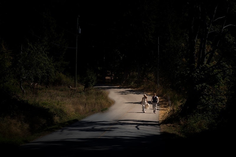 Wedding Photography, couple walking down a long road together