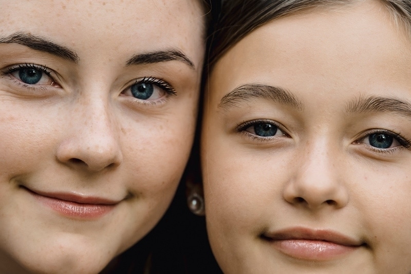 Family Photography, close up of two sisters